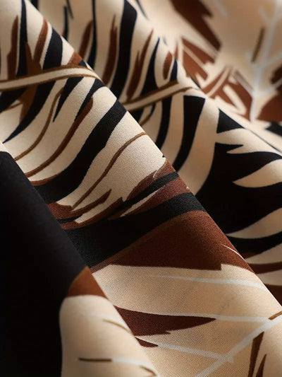 Kamala – A-Linien-Kleid mit Spaghettiträgern und tropischem Print