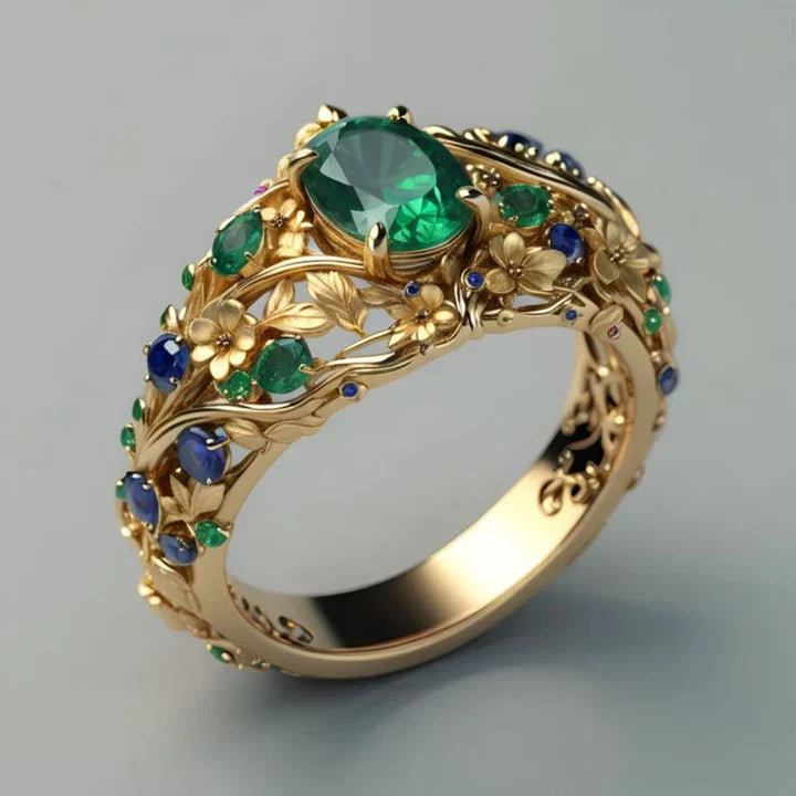Goldring mit grünem und blauem Kristall