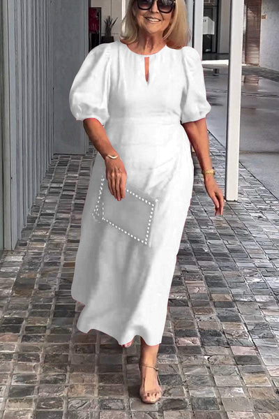 "Natalia | Zeitloses Eleganzkleid" could be rewritten as "Natalia | Klassisches Eleganzkleid".